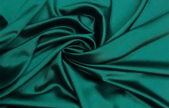 Blankish green dyed acetate satin fabrics