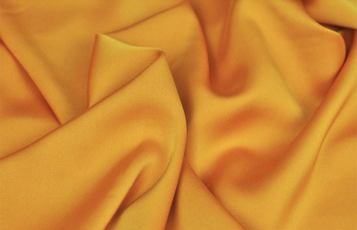 Bright yellow acetate satin fabric